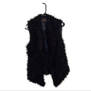 Black fur vest; worn a couple of times; good condition